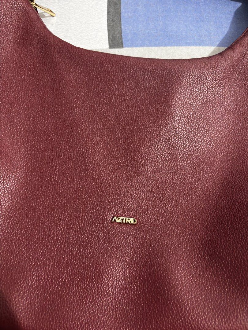 Aztrid Deep Burgundy Medium Hobo Bag (Category: Shoulder Bags) located in Manila. Submitted by niellaeun (Listing ID 1468922615, Image 3). Description: Bought it for 1,199 Good Condition with no visible flaws RFS: Decluttering.
