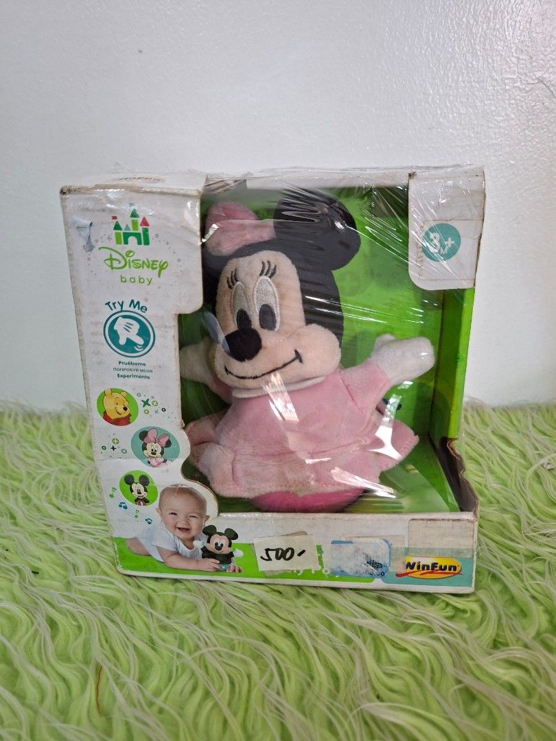 Baby Disney Minnie Mouse interactive plush toy (Category: Interactive Toys) located in Manila. Submitted by happywindmarlyn (Listing ID 1468778621, Image 2). Description: - Baby Disney Minnie Mouse interactive plush toy - Brand/Maker: Produced under the Disney Baby line in collaboration with toy manufacturers such as Clementoni . - Interactive Sound & Music. : It plays gentle, comforting musical tunes, nursery rhymes, and cute sound effects tailo