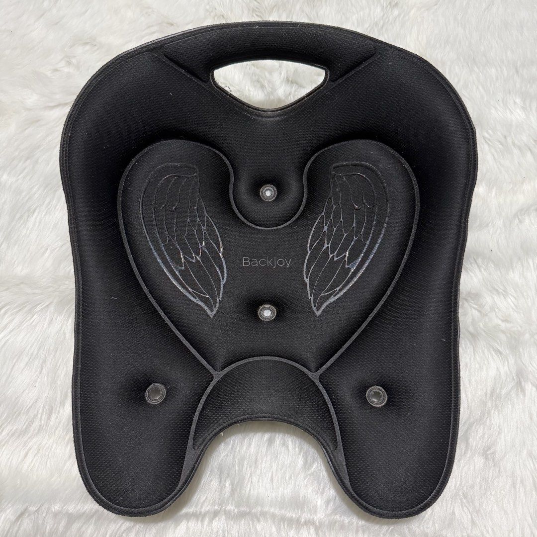 BackJoy Posture Seat Black with Wings Design (Category: Braces, Support & Protection) located in Pasig City. Submitted by mommy_n_me_closet (Listing ID 1468801779, Image 1). Description: - Authentic Black BackJoy posture support seat - Ergonomic design featuring stylish wing graphics - Built-in top handle for effortless portability - Integrated drainage holes for easy maintenance - Ideal for improving sitting posture at home, in the office, or in