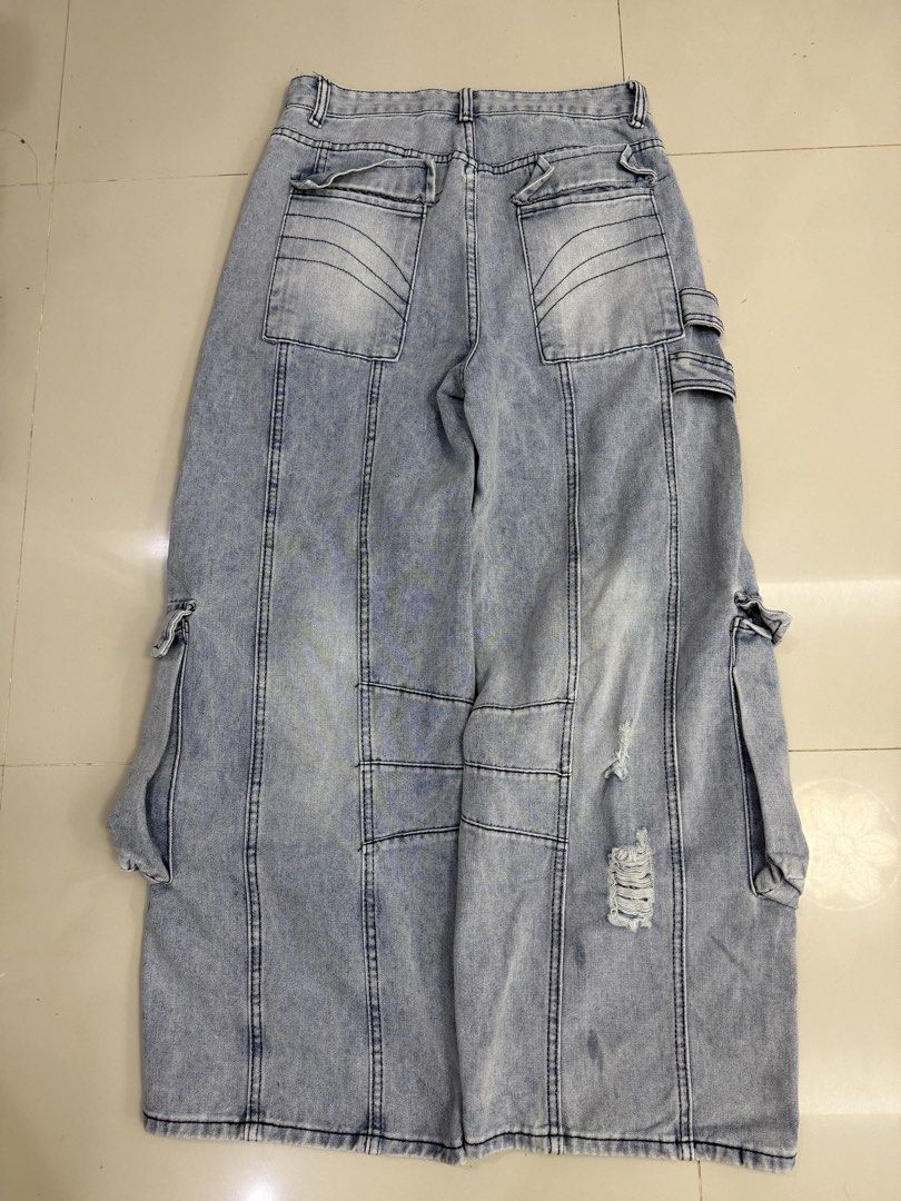 Baggy Cargo Denim Jeans (Category: Jeans) located in Lipa City. Submitted by cokelight11 (Listing ID 1468821163, Image 3). Description: Baggy Cargo Denim Pants Size 28-29 Light wash denim cargo pants with multiple utility pockets, buckle straps, and distressed details. Super baggy fit down the leg. Heavyweight denim with contrast stitching. Great streetwear piece..