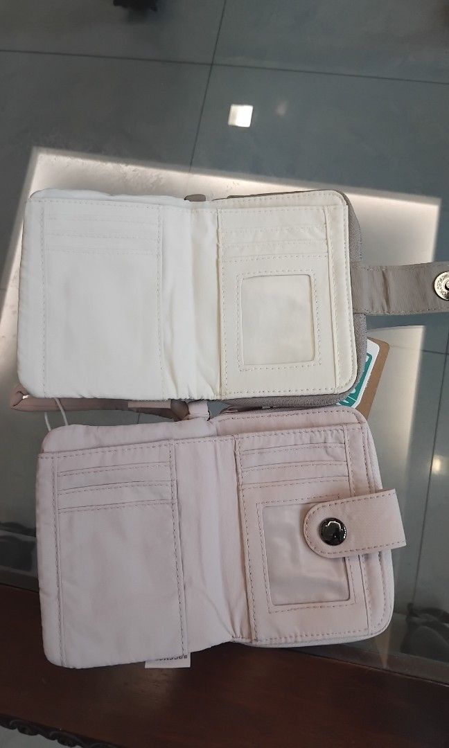 Bagsmart Quilted Wallet ( 400 for two wallets) (Category: Wallets & Card holders) located in Naga. Submitted by camsss_f (Listing ID 1468558767, Image 2). Description: - Brand new with tags still attached - Colors available: Taupe and Light Pink - Stylish quilted design with a secure snap button closure - Interior includes multiple card slots and a clear ID window - Features a zippered accordion compartment with gussets for extra storage - Comes 
