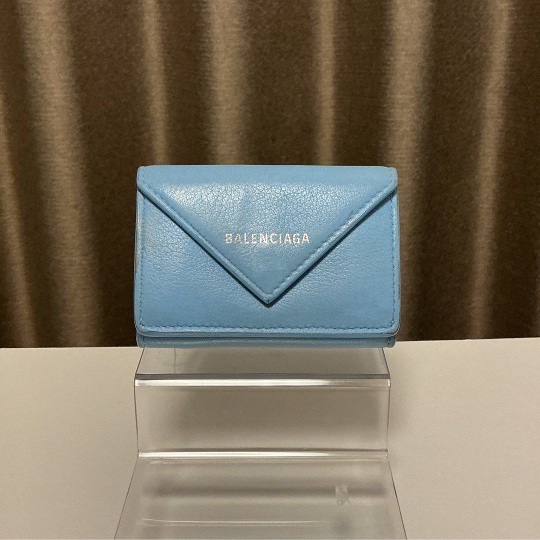 Balenciaga blue compact wallet (Category: Wallets & Card holders) located in Quezon City. Submitted by hintstreet (Listing ID 1468713331, Image 1). Description: Good condition pa po but may discoloration na since used ko na siya. Cash and card slot still in very good condition .