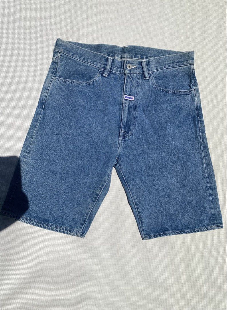 BAPE Denim Shorts Size M Blue (Category: Shorts) located in Tagum. Submitted by waaap420 (Listing ID 1468896829, Image 1). Description: - Brand: BAPE (A Bathing Ape) - Item: Denim Shorts - Color/Wash: Clean Blue Wash - Size: Medium - Fit: Classic fit with zipper fly and button closure - Details: Small BAPE logo tag on front placket - Feature: Bold BAPE lettering printed across back right pocket - Condition: Excellent, ready to wear.