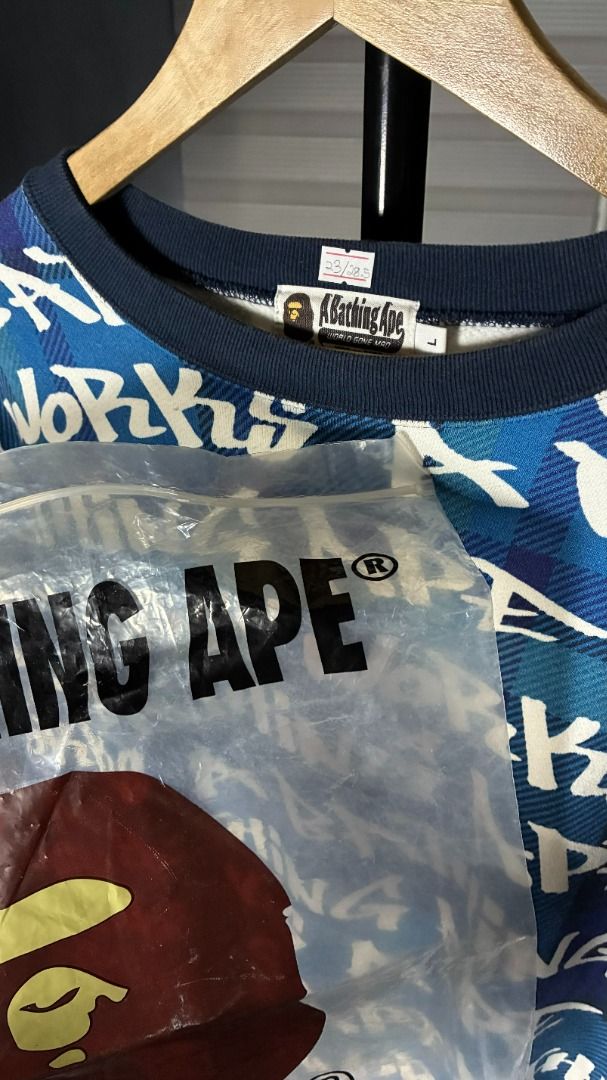 Bape Graffiti Check Crewneck Blue LongSleeve (Category: Coats, Jackets and Outerwear) located in Palayan City. Submitted by goodcatch_store (Listing ID 1468883308, Image 3). Description: Bape Graffiti Check Crewneck Long Sleeve Brand New with Ziplock W -23 L - 28.5.