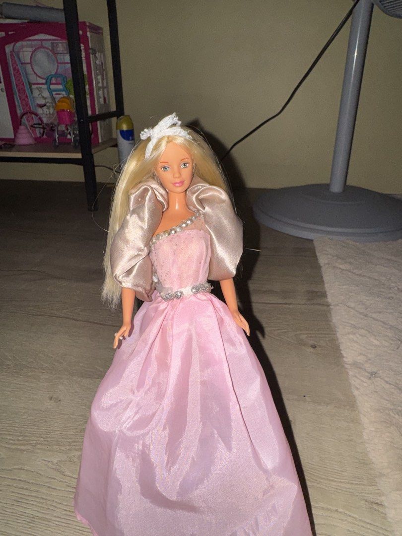 barbie doll (Category: Kids Toys) located in Castillejos. Submitted by yuuukiyu (Listing ID 1468775804, Image 3). Description: MOD-JNT MOP- GCASH UNIDENTIFIED BARBIE FOR SALE! -DRESS COMES FROM FASHION PACK -STAIN ON ONE FOOT -ADDED GEMS ON THE DRESS -NO CRACK NECK - HAIR HAS BEEN WASHED.