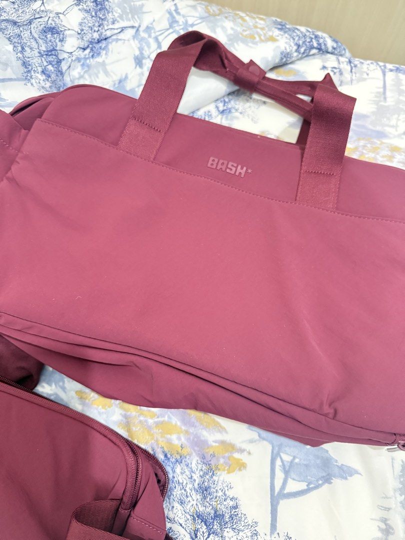 BASH* Maroon Mono Duffle Bag with Pouch in JET SET (Category: Shoulder Bags) located in Dasmarinas. Submitted by shop.jemmy (Listing ID 1468814060, Image 2). Description: Guys, please buy this from me, I checked out 2 bags. Hahahaha! - Brand: BASH* - Color: Maroon - Condition: Brand new with tags attached - Inclusions: Matching smaller pouch -Original Price: 3500 -Selling Price: 2800 na lang!!!.