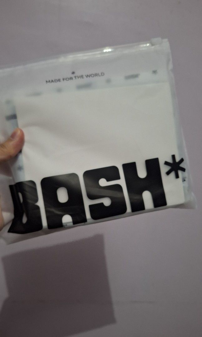 Bash mini cache wallet in frost (Category: Cross-body Bags) located in Caloocan City. Submitted by _mie3 (Listing ID 1468836981, Image 2). Description: - Brand: Bash MNL - Color: Frost - Inclusion: Matching braided rope strap with metal hardware - Condition: Brand new, still wrapped in original packaging with care guide - Style: Simple, sleek, and perfect as an everyday accessory.