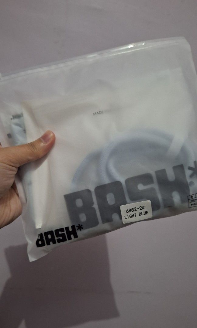 Bash mini cache wallet in frost (Category: Cross-body Bags) located in Caloocan City. Submitted by _mie3 (Listing ID 1468836981, Image 1). Description: - Brand: Bash MNL - Color: Frost - Inclusion: Matching braided rope strap with metal hardware - Condition: Brand new, still wrapped in original packaging with care guide - Style: Simple, sleek, and perfect as an everyday accessory.