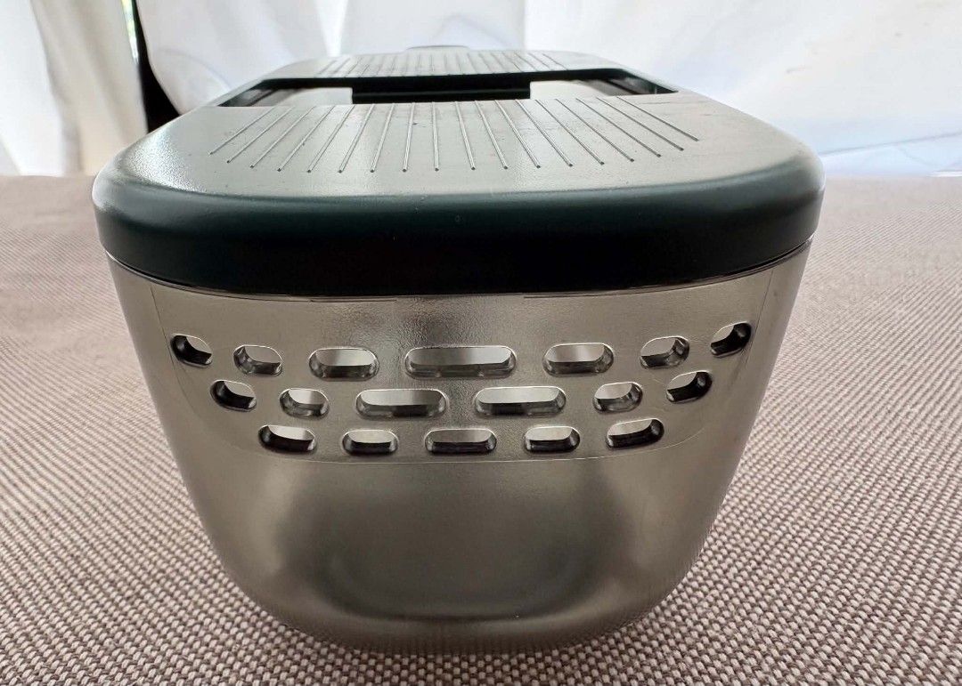 Bear Multi-Function Vegetable Slicer and Grater with 4 Blades (Category: Knives & Chopping Boards) located in Marikina City. Submitted by wildmoon7459 (Listing ID 1468925280, Image 1). Description: - Brand: Bear Multi-Function Vegetable Slicer & Grater Set - Color: Dark green and translucent grey - Blades: 4 interchangeable stainless steel blades for slicing, shredding, and grating - Safety: Includes a hand guard tool to protect fingers - Storage