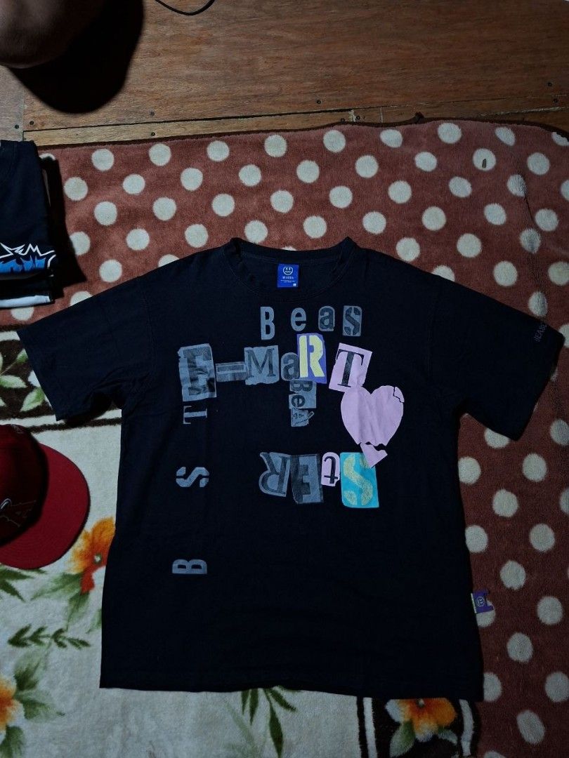 Beaster Black Graphic Tee Size L (Category: Tshirts & Polo Shirts ) located in Rizal. Submitted by thrifthings_10 (Listing ID 1468880362, Image 1). Description: - Brand/Model: Beaster Black Graphic T-Shirt - Size: L - Material: 100% Cotton (soft & comfortable casual wear) - Design: Colorful ransom-style lettering print with a cute pink heart detail on the front - Authenticity details: Branded tags on both the collar and hem - Condition: Clean pri