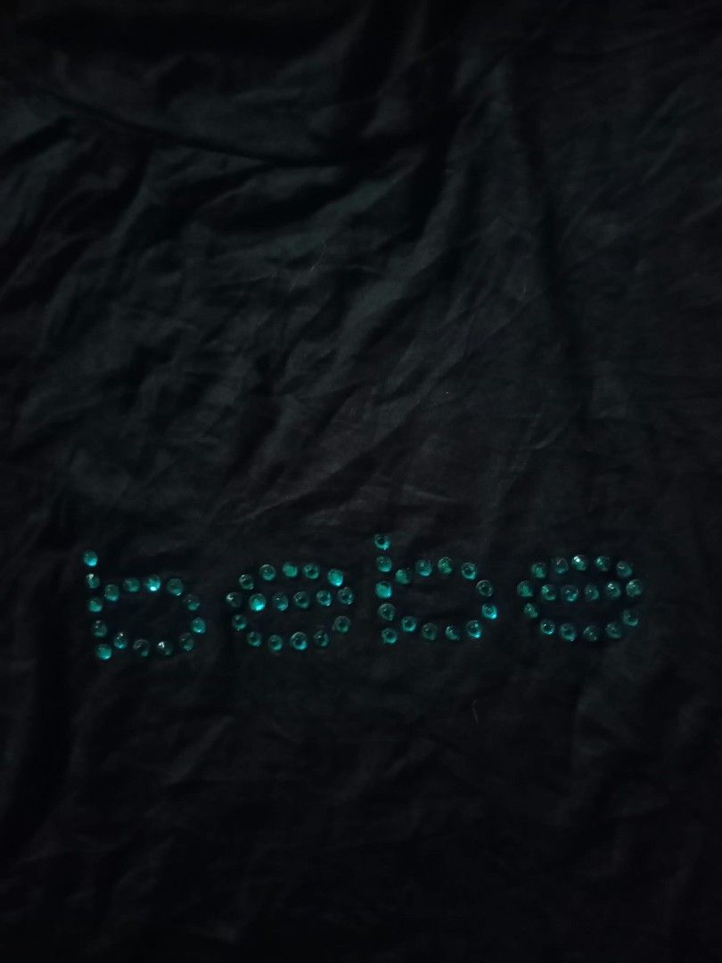 BEBE Beaded Rhinestone Top (Category: Shirts) located in San Fernando. Submitted by avylll_thrift (Listing ID 1468717192, Image 2). Description: ୨୧ BEBE BEADED TOP ₊‧꒰ა ☆ ໒꒱ ‧₊˚ Mine: ₱ 300 Size: M on tag Condition: Like New 𐙚 DETAILS • Rayon Soandex blend • black actual • blue beads • stretchable 𓆩♡𓆪 PLEASE NOTE ✦ Actual color may vary slightly due to lighting. ✦ Please manage expectations when buying preloved pieces. ✦ All flaws will be disc