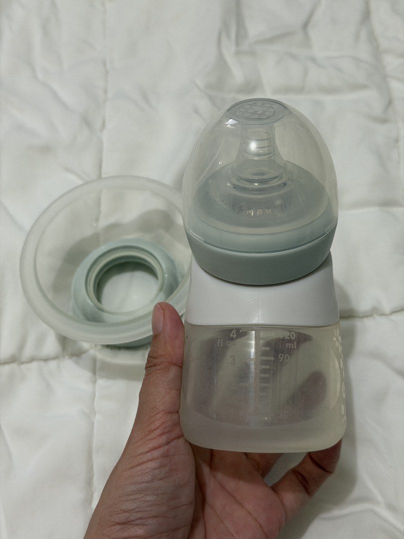 Bebemarc Silicone Breast Pump & Antibacterial Feeding Set (Category: Breastfeeding & Bottle Feeding) located in Mandaluyong City. Submitted by allorashoppe (Listing ID 1468918389, Image 3). Description: - Authentic bebe marc Marcus & Marcus silicone baby bottle - Color: Soft grey and mint green tones - Capacity: Up to 4 fl oz or 120 ml with clear measurement markings - Ergonomic curved body designed for easy gripping - Gentle and safe material id