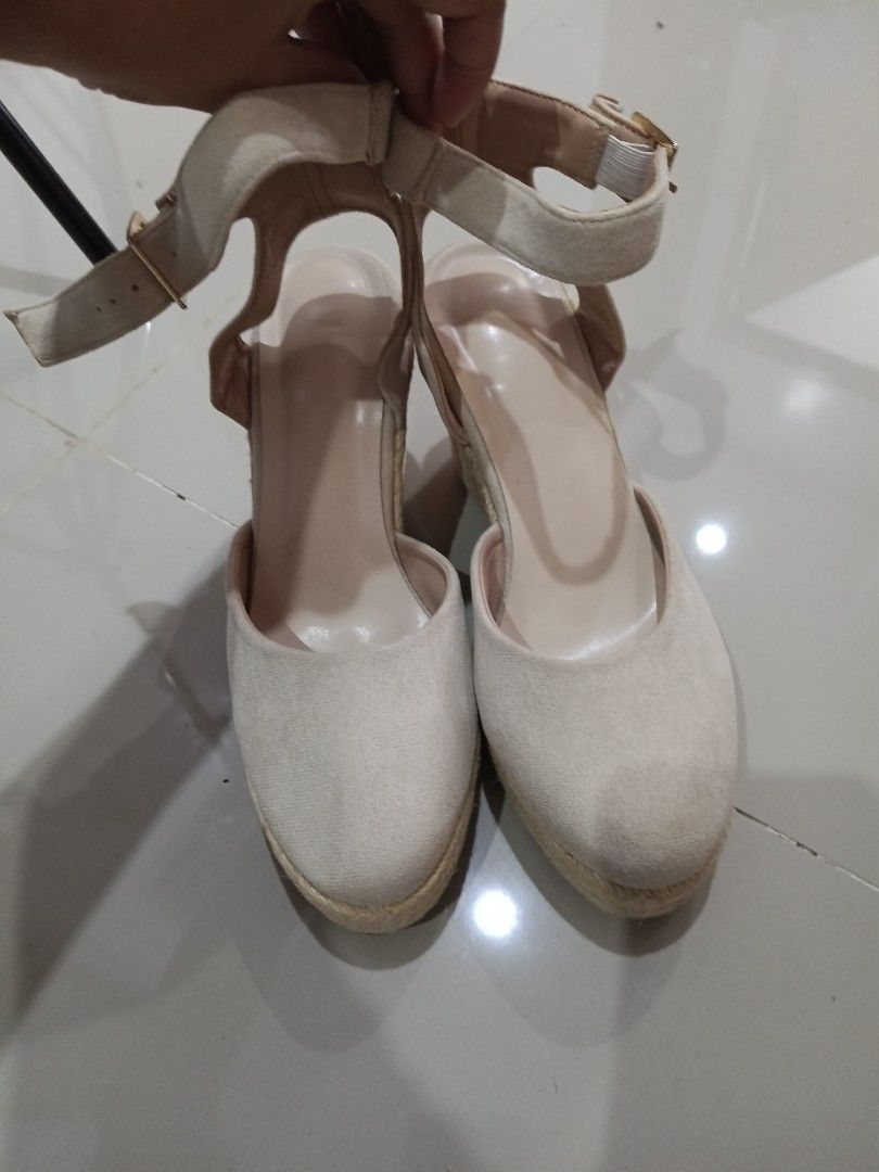 Beige espadrille wedge sandals with ankle strap (Category: Wedges) located in Makati City. Submitted by maymay829 (Listing ID 1468747000, Image 2). Description: - Color: Neutral beige that matches any summer outfit - Design: Closed round toe with soft fabric finish - Closure: Ankle strap with adjustable gold-tone metal buckle - Heel: Woven jute platform wedge - Style: Versatile; easy to dress up or down.