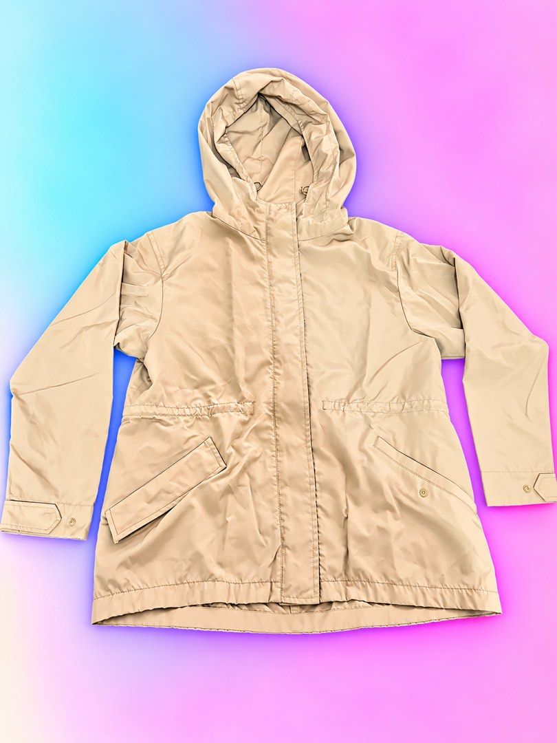 Beige Hooded Utility Jacket with Pockets (Category: Coats, Jackets and Outerwear) located in Quezon City. Submitted by turtleandfishes (Listing ID 1468736960, Image 1). Description: - Color: Beige - Style: Hooded jacket with snap button closure - Features: Front pockets, button cuffs, and adjustable waist cinching - Material: Lightweight and easy to layer - Measurements: ~23" pit to pit, ~25" length.