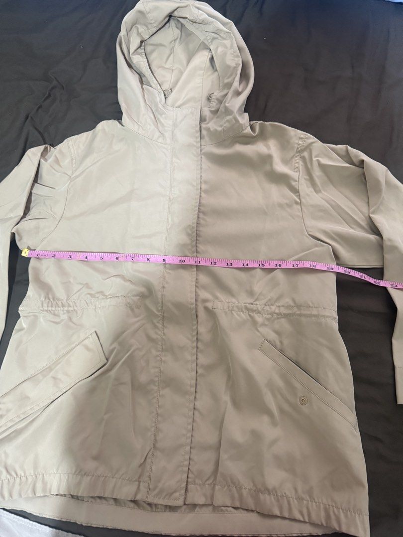 Beige Hooded Utility Jacket with Pockets (Category: Coats, Jackets and Outerwear) located in Quezon City. Submitted by turtleandfishes (Listing ID 1468736960, Image 2). Description: - Color: Beige - Style: Hooded jacket with snap button closure - Features: Front pockets, button cuffs, and adjustable waist cinching - Material: Lightweight and easy to layer - Measurements: ~23" pit to pit, ~25" length.
