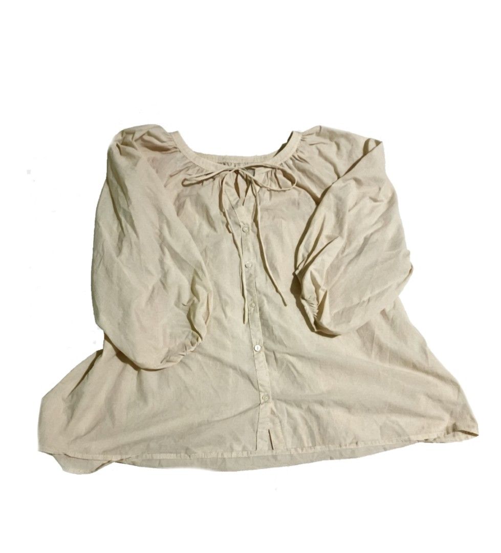 Beige Long Sleeve Button Up Blouse (Category: Longsleeves) located in Muntinlupa City. Submitted by zeezeesells_cloud (Listing ID 1468739788, Image 1). Description: Chic beige long sleeve blouse featuring a loose fit, front buttons, a cute neck tie, and trendy puffed sleeves. Made from lightweight fabric that easily pairs with jeans or skirts. Perfect for everyday wear!.