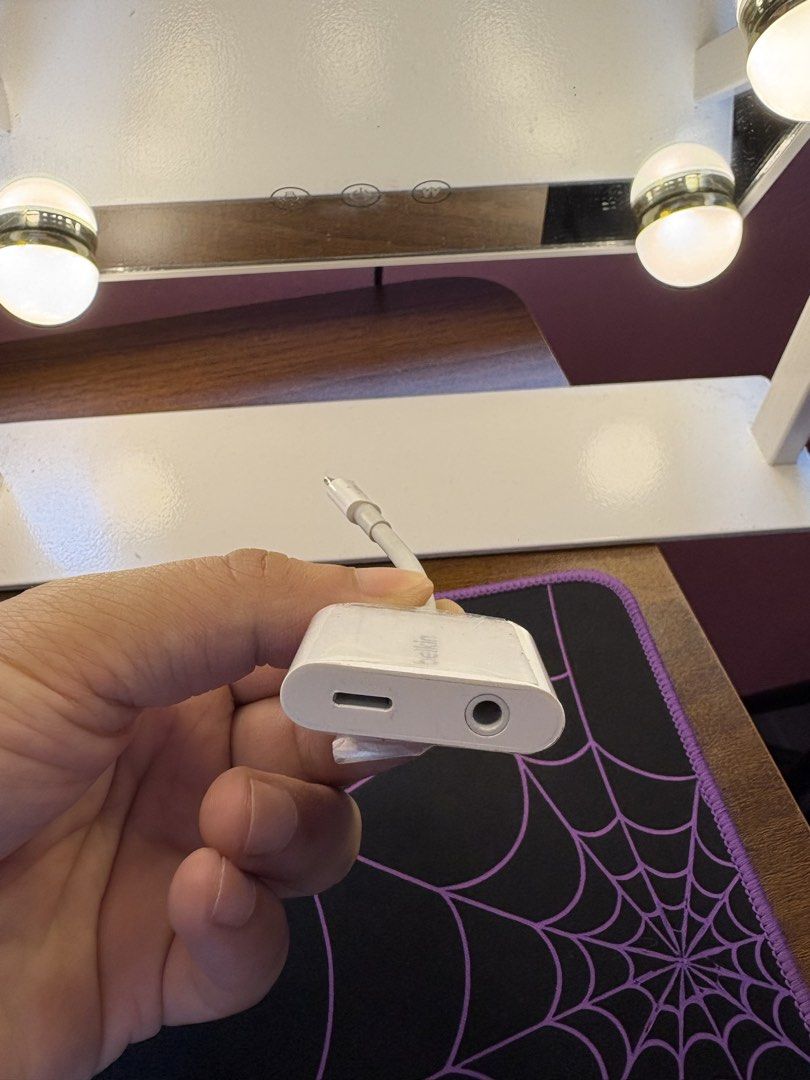 Belkin Lightning Audio + Charge Adapter (Category: Chargers & Cables) located in Caloocan City. Submitted by gabrielcorpuz_07 (Listing ID 1468712795, Image 2). Description: - Brand: Belkin - Color: White - Ports: 1x Lightning charging port, 1x 3.5mm headphone jack - Function: Charge your iPhone and listen to music simultaneously - Condition: Minor signs of wear on the plastic housing, fully working - Compatibility: Works with Lightning-equipped i