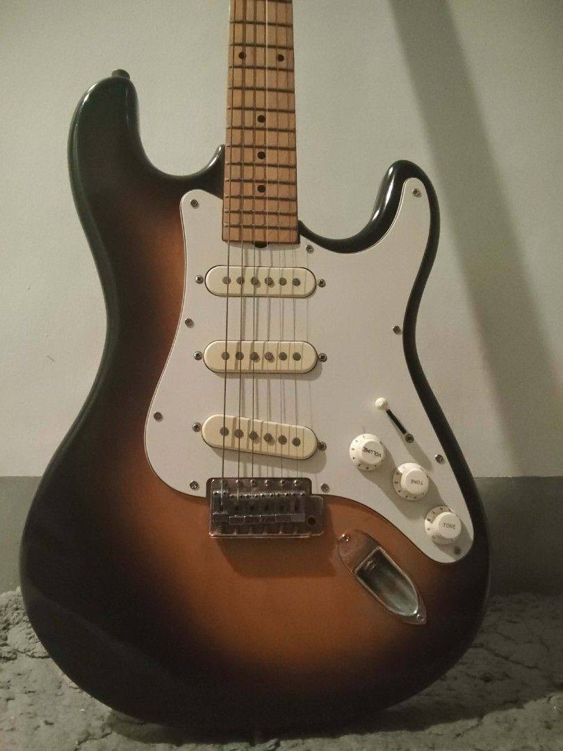 Electric Guitar w/ Amplifier (Bundle) (Category: Musical Instruments) located in Daet. Submitted by mysticstorm.7769a7 (Listing ID 1468713671, Image 2). Description: Retail Price: P7,000 I don't use it anymore, and I need money for school expenses. - Bellwood Super Swinger Sunburst Electric Guitar with maple neck - LG10 amplifier included - Complete starter bundle: brown strap, guitar cable, and assorted guitar picks - 100% working condition - Pl