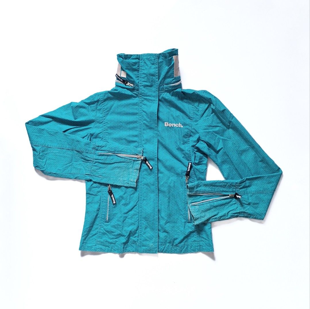 Bench Teal Hooded Windbreaker Hiking Jacket (Category: Coats, Jackets and Outerwear) located in Tarlac. Submitted by brownbasket (Listing ID 1468877609, Image 1). Description: L21 W17.5 Size: SX-S Price + Sf MOP: Gcash | MariBank MOD: J&T.