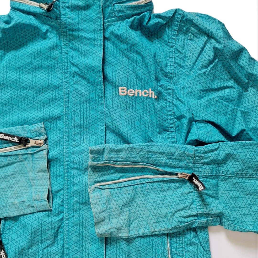 Bench Teal Hooded Windbreaker Hiking Jacket (Category: Coats, Jackets and Outerwear) located in Tarlac. Submitted by brownbasket (Listing ID 1468877609, Image 2). Description: L21 W17.5 Size: SX-S Price + Sf MOP: Gcash | MariBank MOD: J&T.