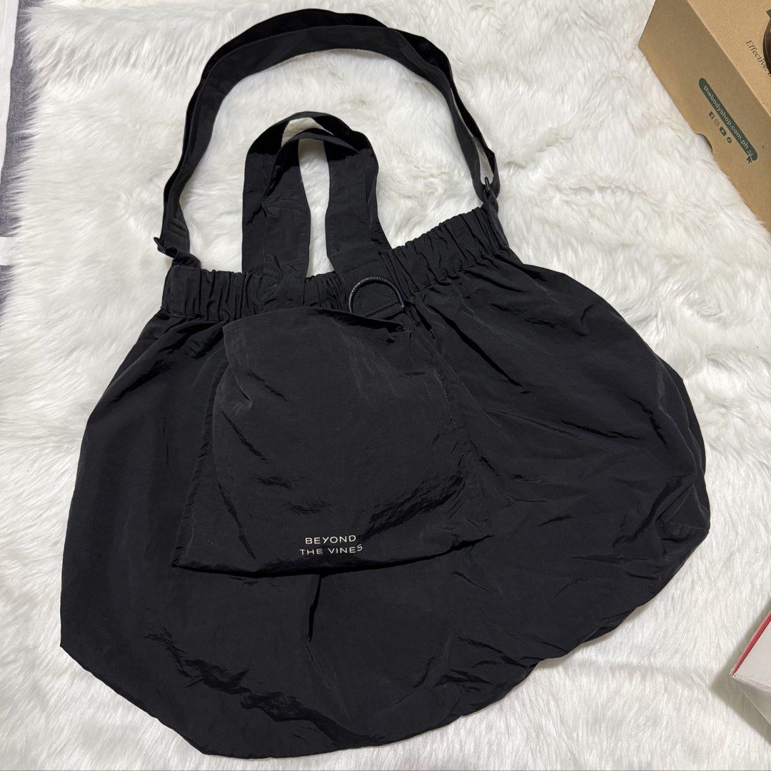 Beyond The Vines XL Dumpling Bag Black (Category: Tote Bags) located in Pasig City. Submitted by mommy_n_me_closet (Listing ID 1468801633, Image 1). Description: - Brand: Beyond The Vines - Item: XL Dumpling Bag - Color: Black - Condition: Used - Inclusions: Original tags, packaging, stickers, and dust bag - Features: Roomy everyday carryall style.