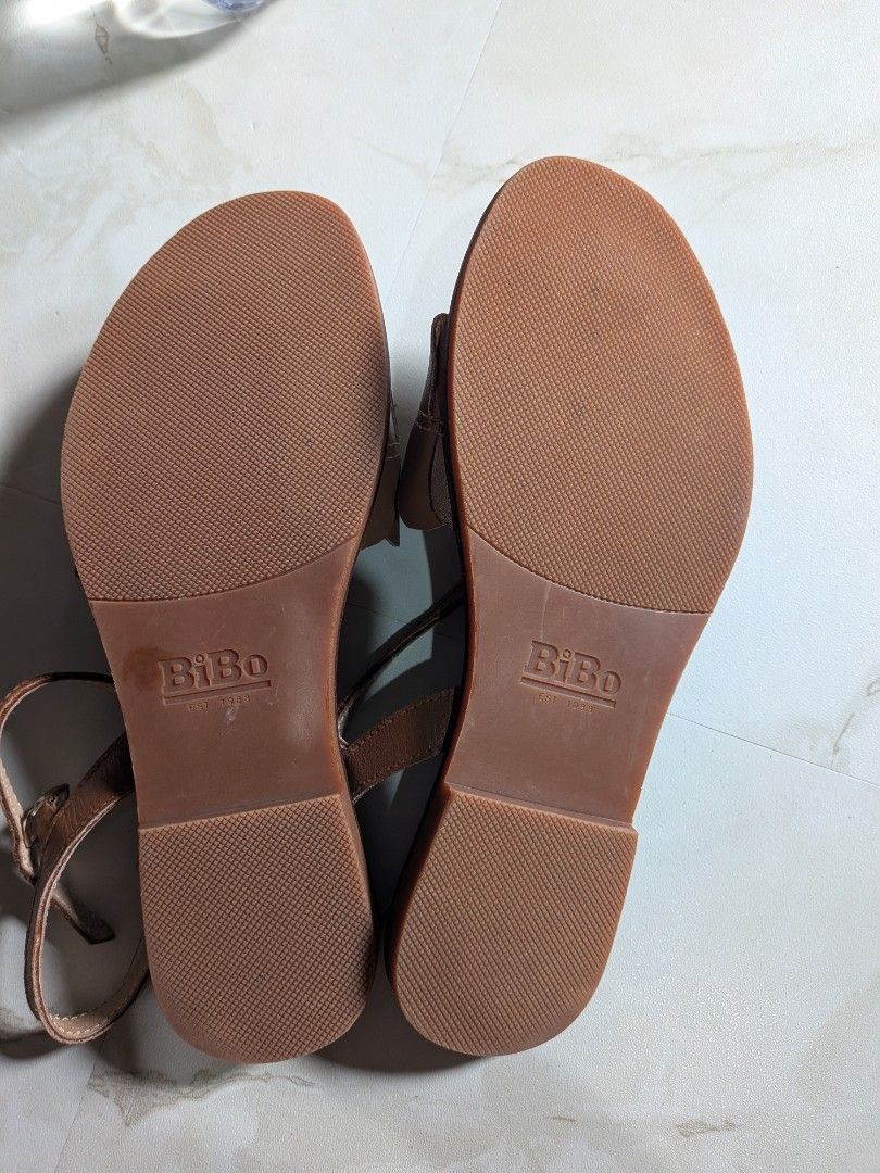 BiBo Brown Scalloped Strappy Sandals (Category: Flats & Sandals) located in Rizal. Submitted by yellowsandtea (Listing ID 1468752160, Image 3). Description: - Brand: BiBo (Since 1989) - Material: Genuine nappa leather (upper), genuine pigskin (lining), genuine cow tooling leather (footbed), rubber (sole) - Design: Front strap with scalloped petal detail - Closure: Adjustable buckle on the back ankle strap - Sole: Textured anti-slip rubber for bet