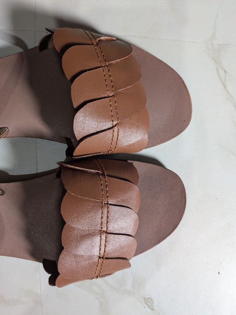 BiBo Brown Scalloped Strappy Sandals (Category: Flats & Sandals) located in Rizal. Submitted by yellowsandtea (Listing ID 1468752160, Image 2). Description: - Brand: BiBo (Since 1989) - Material: Genuine nappa leather (upper), genuine pigskin (lining), genuine cow tooling leather (footbed), rubber (sole) - Design: Front strap with scalloped petal detail - Closure: Adjustable buckle on the back ankle strap - Sole: Textured anti-slip rubber for bet