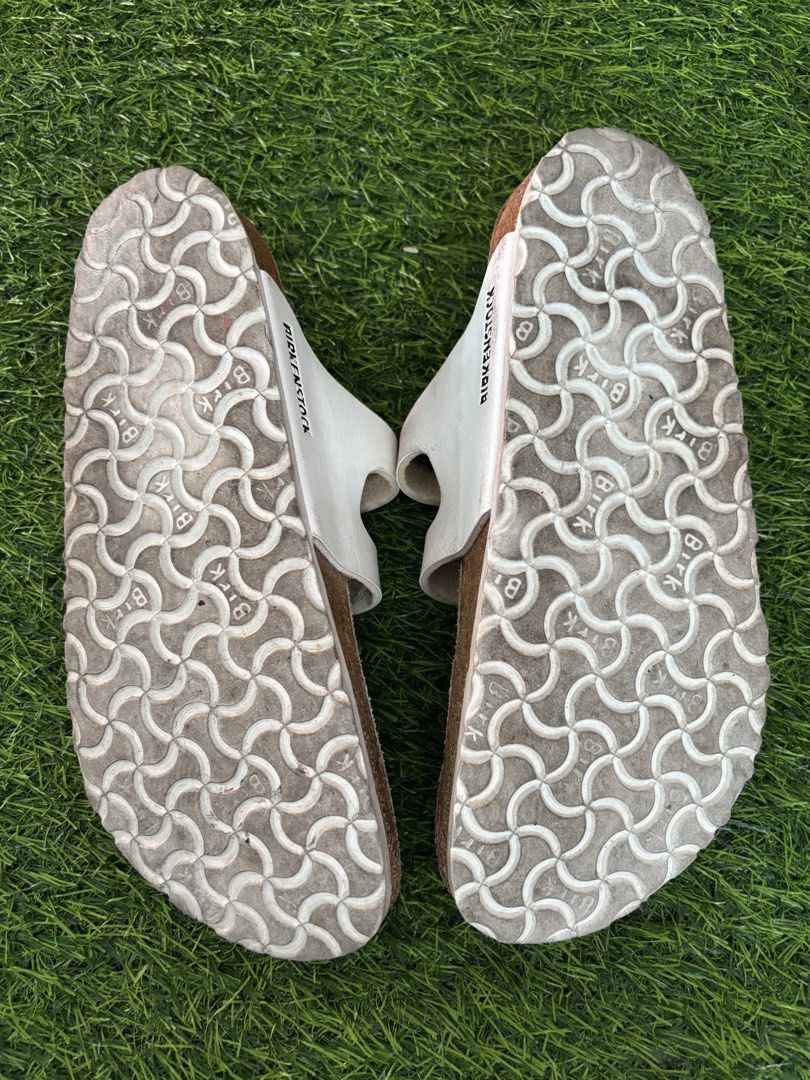 Birkenstock White T-Strap Sandals Size 40 (Category: Flats & Sandals) located in Makati City. Submitted by rare_thrift_stuff (Listing ID 1468730916, Image 3). Description: - Brand: Birkenstock - Color: White - Size: EU 40 - Style: T-strap with double adjustable buckle straps - Material/Features: Cork footbed, patterned rubber outsole, Made in Germany - Condition: Normal wear on footbeds and outsoles from previous use - 100% authentic and super co