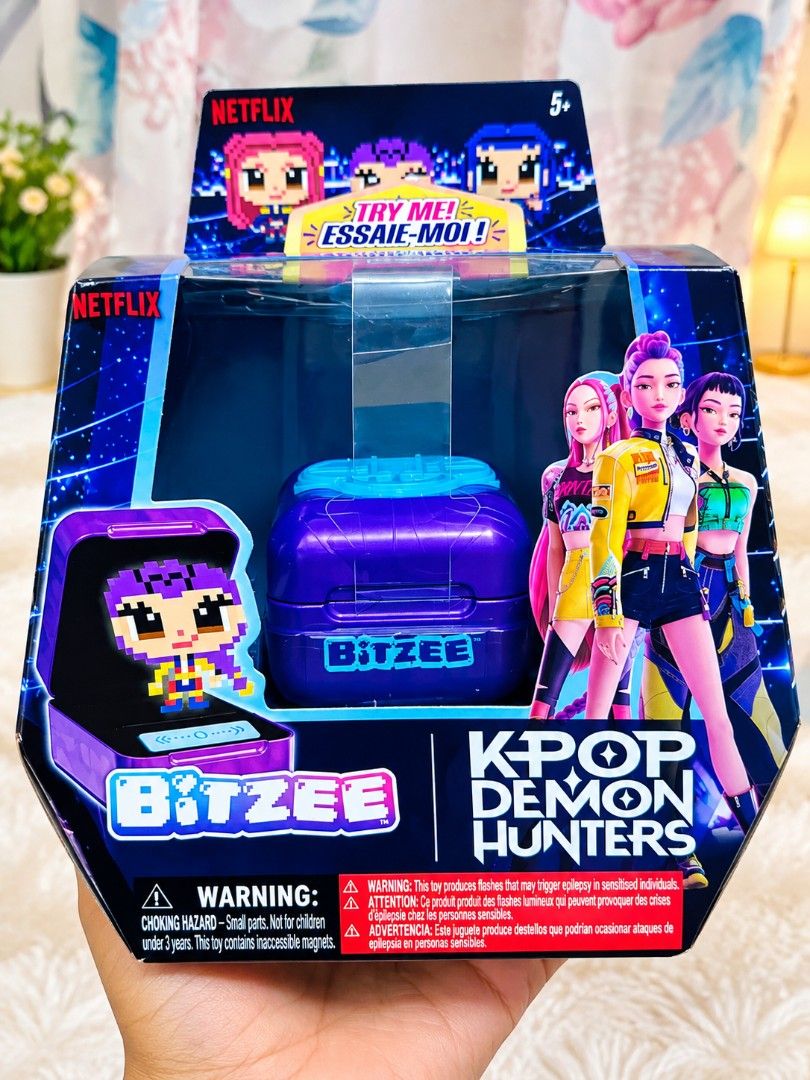 Bitzee - K-pop Demon hunters (Category: Educational & Learning Toys) located in Mandaluyong City. Submitted by twovv (Listing ID 1468929941, Image 1). Description: Key Features Screen-Free 3D Digital Pet: Features a holographic purple pod where virtual characters pop up in a tactile, touch-responsive display. Interactive Controls: Responds when you tap, swipe, tilt, or shake the pod. Characters: Lets you collect and unlock multiple characters fro