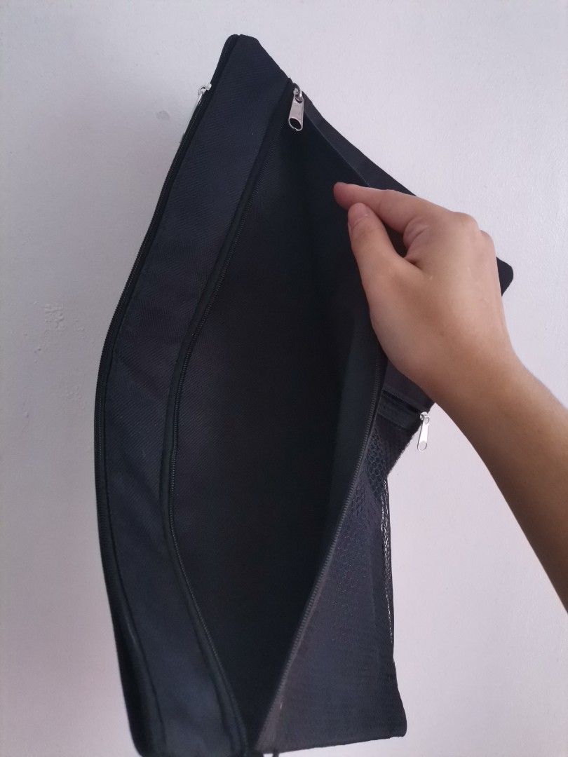 Black Canvas Document Pouch with Mesh Pocket (Category: Belt bags, Clutches and Pouches) located in Makati City. Submitted by kookybearsstuff (Listing ID 1468773421, Image 3). Description: - Color: Sleek black canvas design - Storage: Wide-opening main compartment for documents and daily essentials - Pocket: Front zipped pocket with black mesh for easy visibility - Hardware: Smooth, reliable zippers on all compartments - Interior: Clean inside li