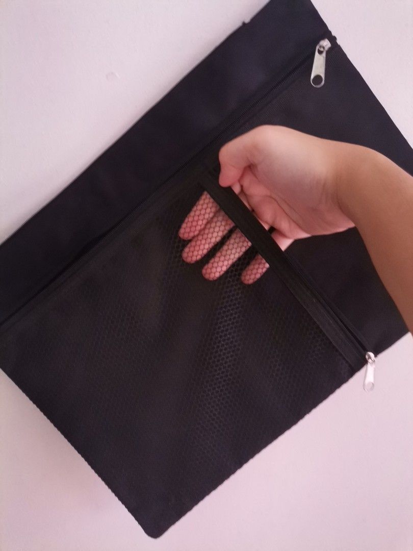 Black Canvas Document Pouch with Mesh Pocket (Category: Belt bags, Clutches and Pouches) located in Makati City. Submitted by kookybearsstuff (Listing ID 1468773421, Image 2). Description: - Color: Sleek black canvas design - Storage: Wide-opening main compartment for documents and daily essentials - Pocket: Front zipped pocket with black mesh for easy visibility - Hardware: Smooth, reliable zippers on all compartments - Interior: Clean inside li