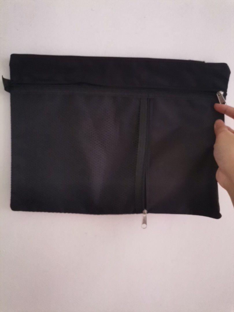 Black Canvas Document Pouch with Mesh Pocket (Category: Belt bags, Clutches and Pouches) located in Makati City. Submitted by kookybearsstuff (Listing ID 1468773421, Image 1). Description: - Color: Sleek black canvas design - Storage: Wide-opening main compartment for documents and daily essentials - Pocket: Front zipped pocket with black mesh for easy visibility - Hardware: Smooth, reliable zippers on all compartments - Interior: Clean inside li