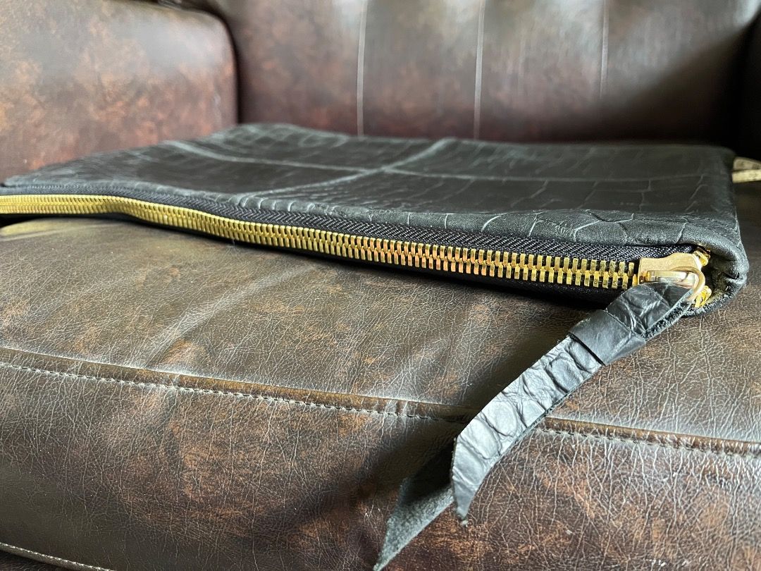 Black crocodile embossed leather zip clutch bag (Category: Clutches) located in Makati City. Submitted by Ina_Ndang (Listing ID 1468719409, Image 3). Description: Black croc-embossed leather clutch/envelope bag Can be used as laptop or document bag No flaws except sign of use Approx. dimension: 14.5" (W), 10" (H) Payment thru Gcash Shipping thru J&T or depending on available courier NO RUSH shipping NO RETURN.
