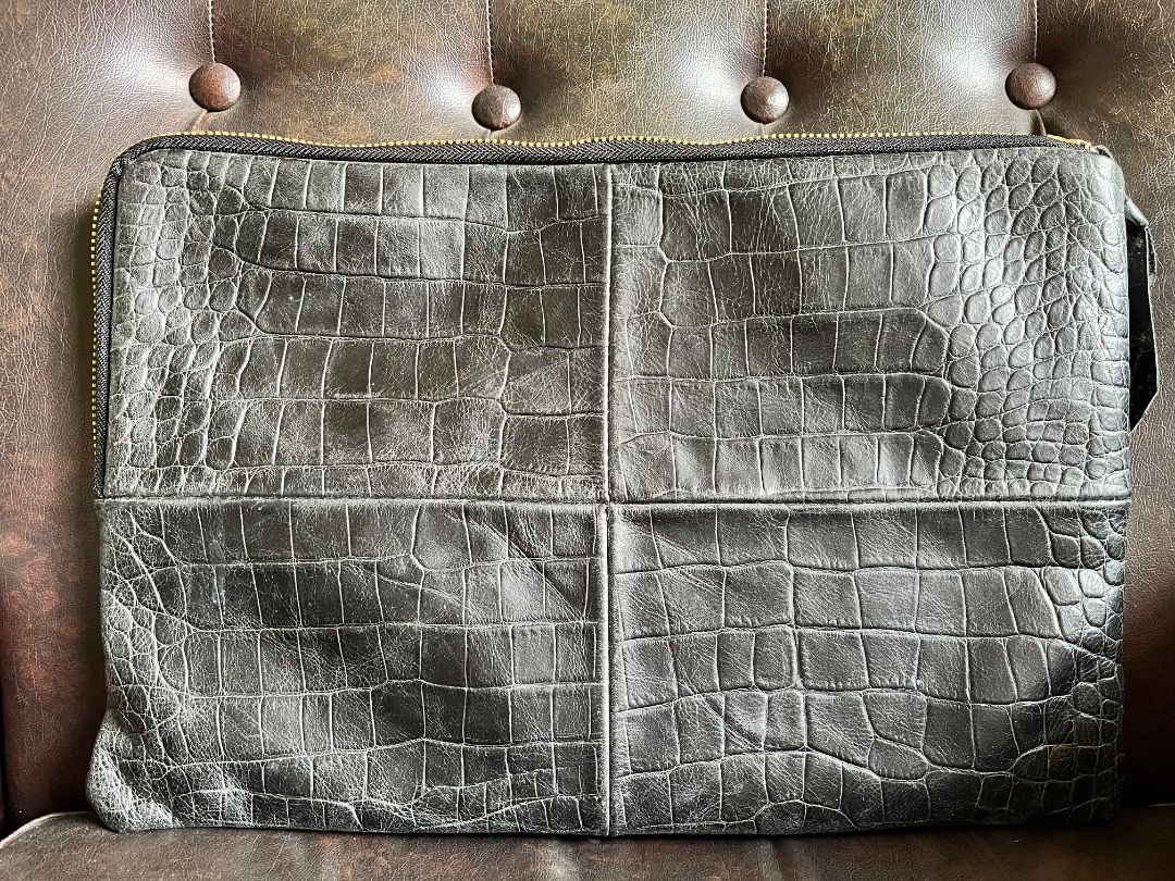 Black crocodile embossed leather zip clutch bag (Category: Clutches) located in Makati City. Submitted by Ina_Ndang (Listing ID 1468719409, Image 2). Description: Black croc-embossed leather clutch/envelope bag Can be used as laptop or document bag No flaws except sign of use Approx. dimension: 14.5" (W), 10" (H) Payment thru Gcash Shipping thru J&T or depending on available courier NO RUSH shipping NO RETURN.