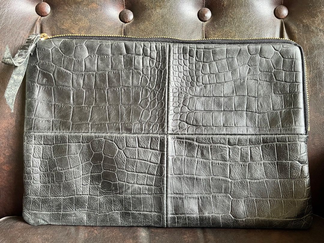 Black crocodile embossed leather zip clutch bag (Category: Clutches) located in Makati City. Submitted by Ina_Ndang (Listing ID 1468719409, Image 1). Description: Black croc-embossed leather clutch/envelope bag Can be used as laptop or document bag No flaws except sign of use Approx. dimension: 14.5" (W), 10" (H) Payment thru Gcash Shipping thru J&T or depending on available courier NO RUSH shipping NO RETURN.
