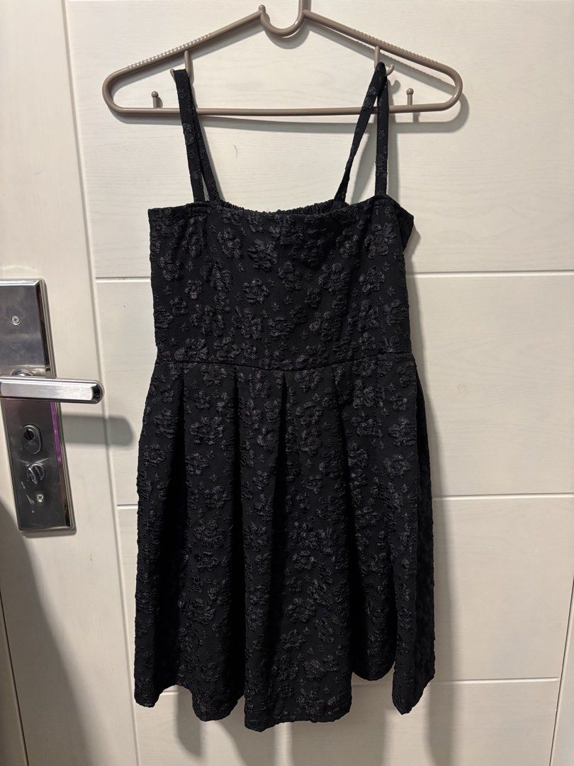 Black Floral Textured Spaghetti Strap Mini Dress (Category: Dresses) located in Manila. Submitted by chinventory (Listing ID 1468735199, Image 1). Description: - Color: Black - Design: Textured floral pattern throughout - Style: Fitted bodice, flared skirt with pleated details, simple neckline, thin spaghetti straps, garterized - Length: Short (above the knee) - Occasion: Versatile for casual outings or evening events - Size: Fits XS-S - Conditio