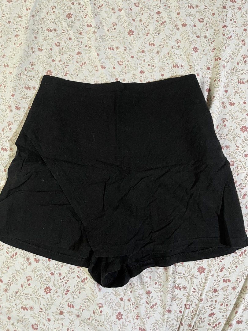 Black high-waisted wrap skort (Category: Shorts) located in Marikina City. Submitted by prel0vedbymari (Listing ID 1468778259, Image 1). Description: - Waistband: Gathered elastic back for a comfortable and easy fit - Fabric: Soft and lightweight material -Has pockets .