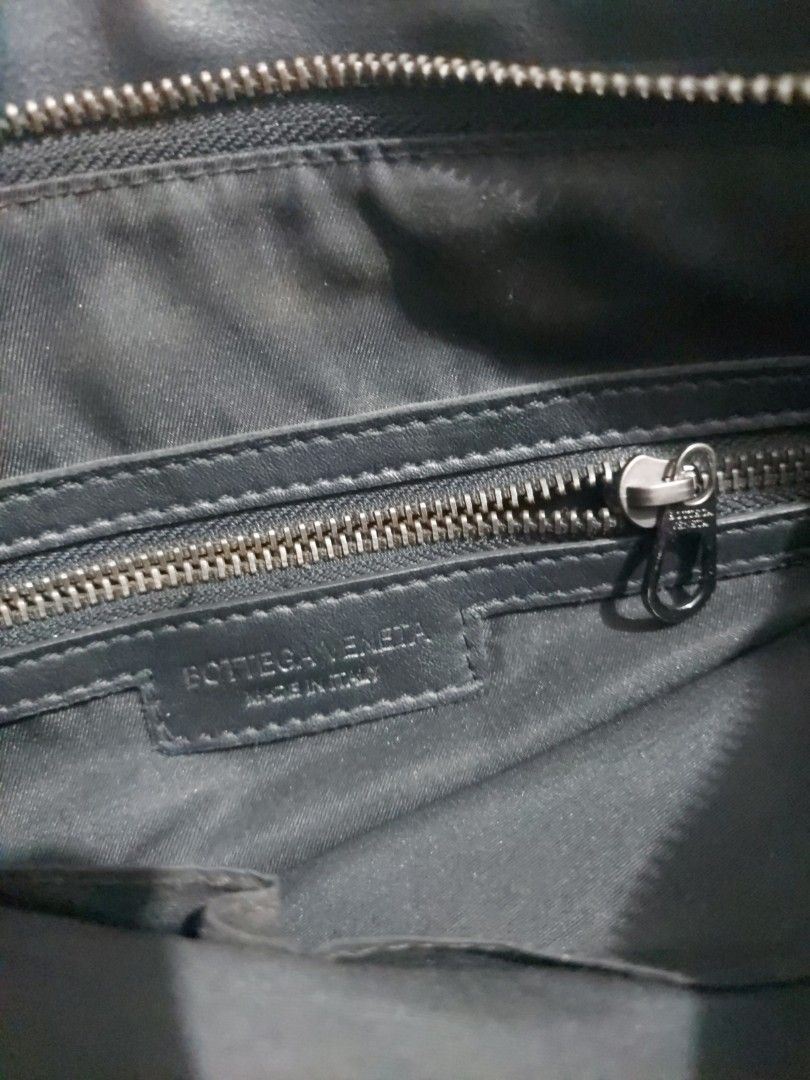 Black Leather Handbag (Category: Luxury Bags & Wallets) located in Quezon City. Submitted by never_a_clutter (Listing ID 1468810899, Image 2). Description: - Material: Genuine black leather with durable fabric lining - Compartments: Secure zippered main closure and open interior slip pocket - Capacity: Roomy interior, perfect for carrying all your daily essentials - Condition: Minor wear on the inner lining from regular use - For you to authentic