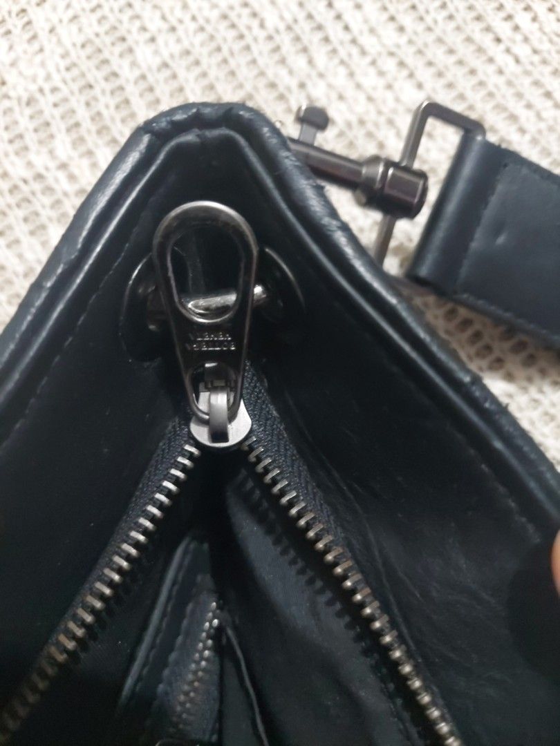 Black Leather Handbag (Category: Luxury Bags & Wallets) located in Quezon City. Submitted by never_a_clutter (Listing ID 1468810899, Image 3). Description: - Material: Genuine black leather with durable fabric lining - Compartments: Secure zippered main closure and open interior slip pocket - Capacity: Roomy interior, perfect for carrying all your daily essentials - Condition: Minor wear on the inner lining from regular use - For you to authentic