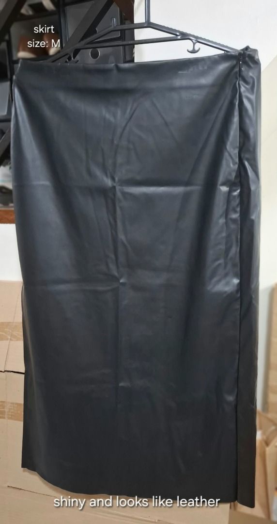 Black Leather-Look Skirt (Category: Skirts) located in Pasig City. Submitted by dripcounty (Listing ID 1468837152, Image 1). Description: Black Leather-Look Skirt ₱200 Size: Medium Condition: Preloved; please check actual photos Black shiny leather-look skirt. Material composition is unconfirmed; not advertised as genuine leather. Actual item shown in photos. Delivery fee shouldered by buyer (Lalamove / other courier). Item price excludes deliver