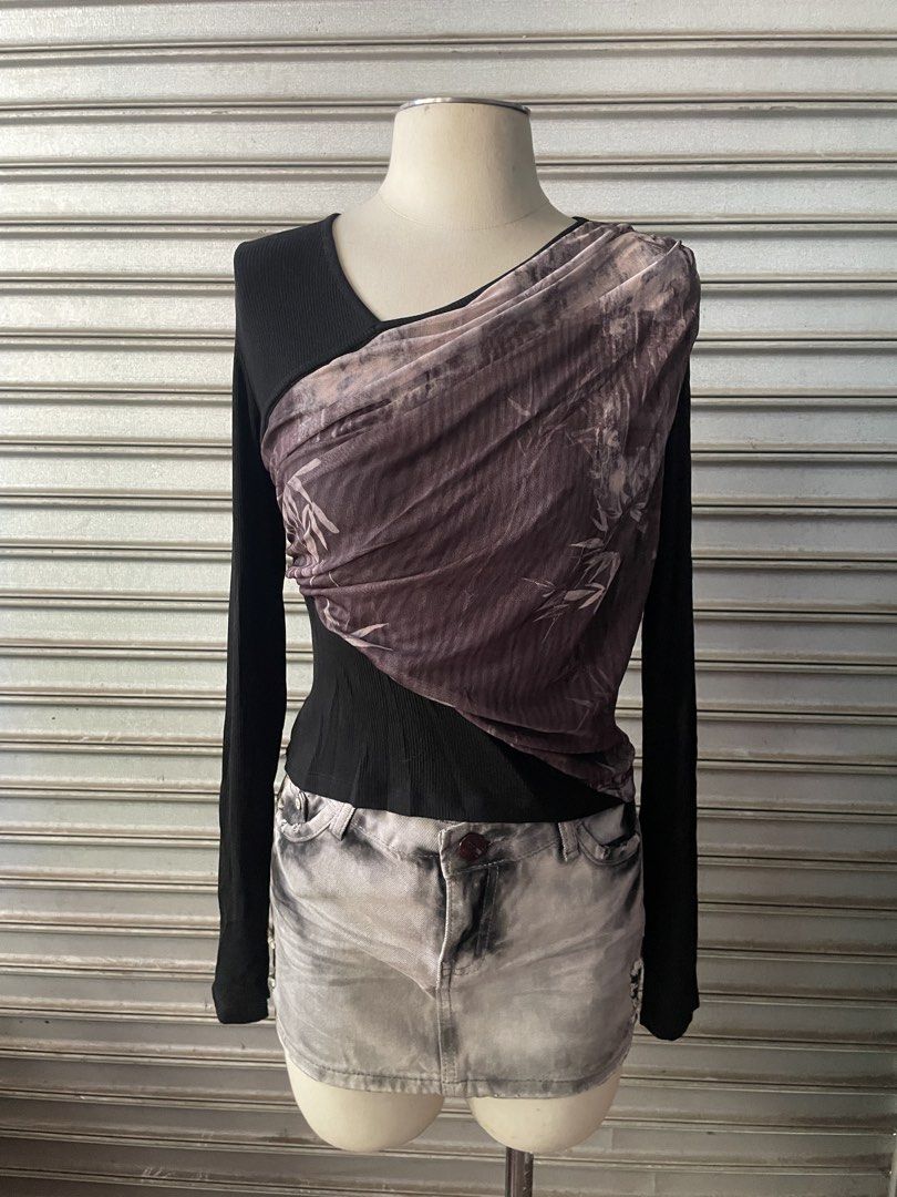 Black Long Sleeve Top with Draped Printed Mesh Overlay (Category: Longsleeves) located in Davao. Submitted by riab_qt (Listing ID 1468776260, Image 2). Description: - Color: Black - Material: Soft, stretchy ribbed fabric - Design: Diagonal draped sheer mesh overlay with a muted bamboo print - Features: Trendy thumbholes on cuffs and layered asymmetrical cut - Style: Unique streetwear look (skirt not included).