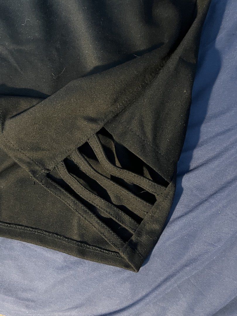 Black mini skirt with side cutout strap details (Category: Skirts) located in Marikina City. Submitted by yssacee (Listing ID 1468916401, Image 2). Description: - Color: Solid black - Fit: Stretchy fabric with an elastic waistband in the back for easy wear - Design: Pull-on style with trendy cutout strap details on the side hem - Length: Mini skirt - PM for more photos, sizing inquiry - fits XS-S womens - shipping from lower Antipolo Rizal.