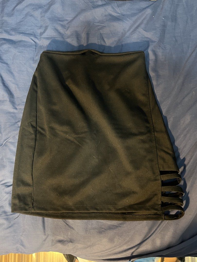 Black mini skirt with side cutout strap details (Category: Skirts) located in Marikina City. Submitted by yssacee (Listing ID 1468916401, Image 1). Description: - Color: Solid black - Fit: Stretchy fabric with an elastic waistband in the back for easy wear - Design: Pull-on style with trendy cutout strap details on the side hem - Length: Mini skirt - PM for more photos, sizing inquiry - fits XS-S womens - shipping from lower Antipolo Rizal.