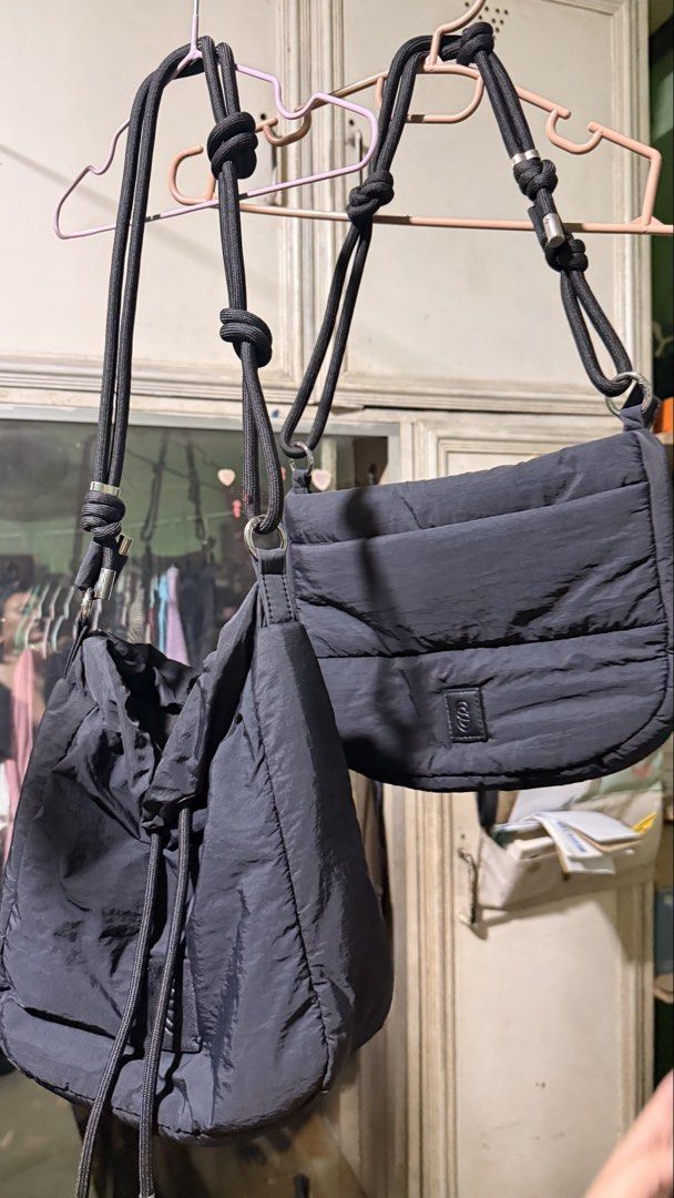 Black Nylon Puffer Shoulder Bag & Drawstring Bucket Bag Set (Category: Shoulder Bags) located in Cainta. Submitted by frtzjy_ (Listing ID 1468763924, Image 1). Description: - Set of 2 versatile black bags made from lightweight crinkled nylon - Bag 1: Structured flap design with quilted sections and a front logo patch - Bag 2: Slouchy drawstring bucket bag with thick rope straps - Adjustable knots on cords allow easy drop length customization - Pe