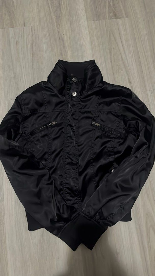 Black Satin Bomber Jacket with Zipper Pockets (Category: Coats, Jackets and Outerwear) located in Manila. Submitted by littlenicsfinds (Listing ID 1468741070, Image 1). Description: - Style: Casual black satin bomber jacket with a stylish slight sheen - Material: Lightweight and comfortable for cooler days - Closure: Secure zip-up front with added button details at the collar - Pockets: Two functional front chest pockets with zippers - Fit: Ribbe
