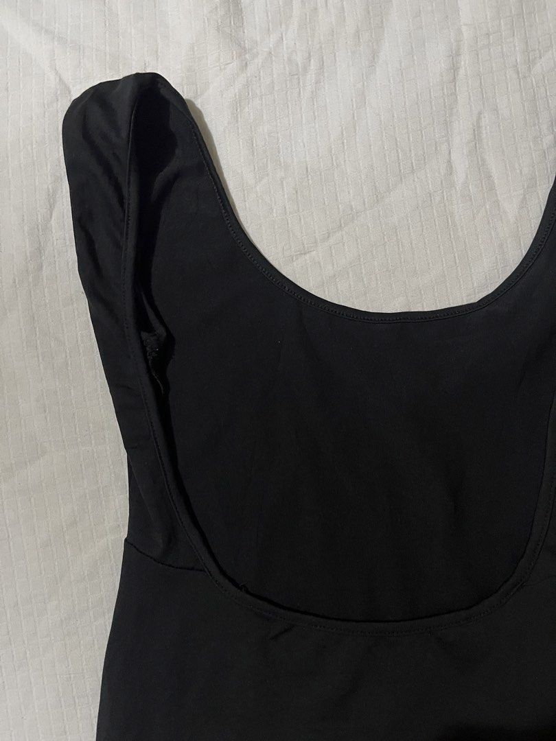 Black Scoop Neck Workout Romper (Category: Rompers) located in Quezon City. Submitted by earthtodior (Listing ID 1468732862, Image 2). Description: - Color: Classic Black - Design: Scoop neckline with wide straps and minimal seams - Fit: Fitted silhouette through the bodice and shorts - Material: Stretchy, comfortable fabric for easy movement - Versatility: Ideal for workouts, dance classes, or casual wear.