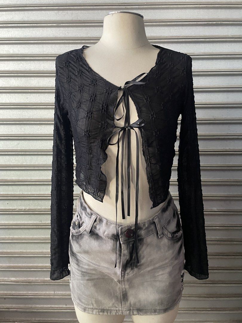 Black sheer textured tie-front crop top (Category: Blouses) located in Davao. Submitted by riab_qt (Listing ID 1468776683, Image 2). Description: - Color: Black - Style: Sheer long-sleeve crop top with V-neckline - Details: Front tie closure with dual black satin ribbons and lettuce-hem edges - Fabric: Lightweight and slightly see-through - Fit: True to size; ideal for layering or going-out fits.