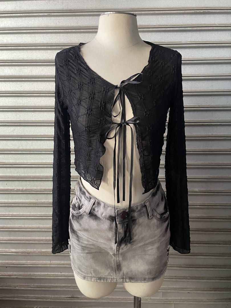 Black sheer textured tie-front crop top (Category: Blouses) located in Davao. Submitted by riab_qt (Listing ID 1468776683, Image 1). Description: - Color: Black - Style: Sheer long-sleeve crop top with V-neckline - Details: Front tie closure with dual black satin ribbons and lettuce-hem edges - Fabric: Lightweight and slightly see-through - Fit: True to size; ideal for layering or going-out fits.