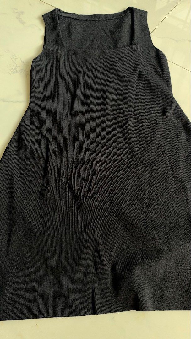 Black square neck sleeveless mini dress (Category: Dresses) located in Manila. Submitted by patc20 (Listing ID 1468793713, Image 2). Description: - Style: Casual sleeveless mini dress - Neckline: Trendy square neckline - Material: Comfortable ribbed texture throughout - Fit: Body-hugging fitted cut - Versatility: Great for everyday wear or easy layering - Note: Approximate length is shown in the photos using a measuring tape.
