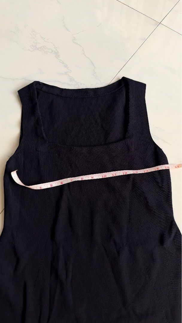 Black square neck sleeveless mini dress (Category: Dresses) located in Manila. Submitted by patc20 (Listing ID 1468793713, Image 3). Description: - Style: Casual sleeveless mini dress - Neckline: Trendy square neckline - Material: Comfortable ribbed texture throughout - Fit: Body-hugging fitted cut - Versatility: Great for everyday wear or easy layering - Note: Approximate length is shown in the photos using a measuring tape.